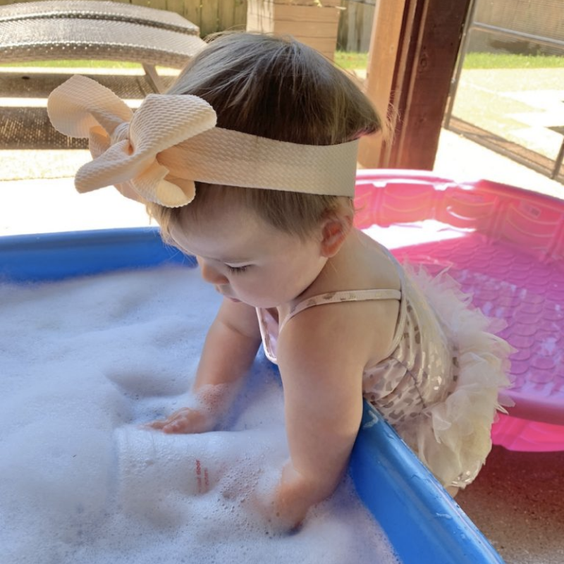 Are you looking for activities for 1 year olds? This post has over 50 easy ideas including sensory play, outdoor activities, indoor activities and places to go! You will love these simple ideas to play with your one year old!